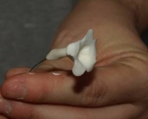Inserting a wire into a gum paste flower